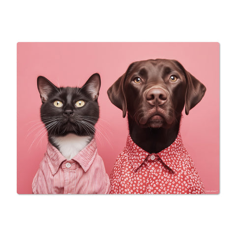 Cat and dog wearing red shirts on a pink background