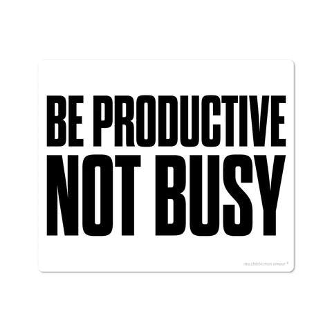 A black vinyl mouse pad with white bold typography text saying 'BE PRODUCTIVE NOT BUSY'.
