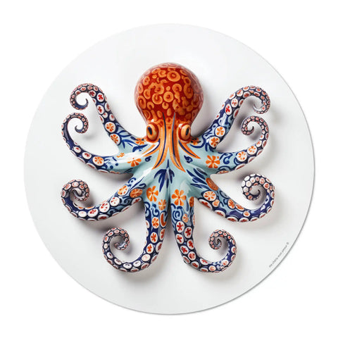 Elevate your dining experience with our round vinyl placemat featuring a captivating octopus design, inspired by Portuguese ceramic artistry. These placemats boast bold colors. Bring a touch of maritime charm to your table setting.