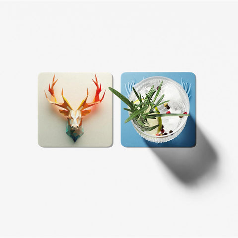 Two coasters with artistic designs on a white background