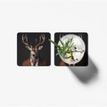Two coasters with a deer and a cocktail design on a white background