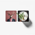 Two coasters with a deer in a suit and a cocktail design on a white background