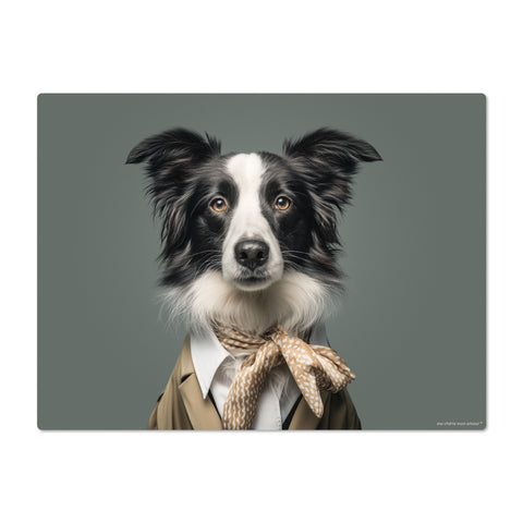 Dog wearing a suit and bow tie on a gray background