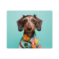 A vinyl mouse pad with a whimsical dog head design, featuring a brown dog with a colorful shirt against a light blue background.