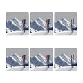 Set of six coasters with skis against a mountain background on a white background