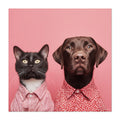Cat and dog wearing red shirts on a pink background