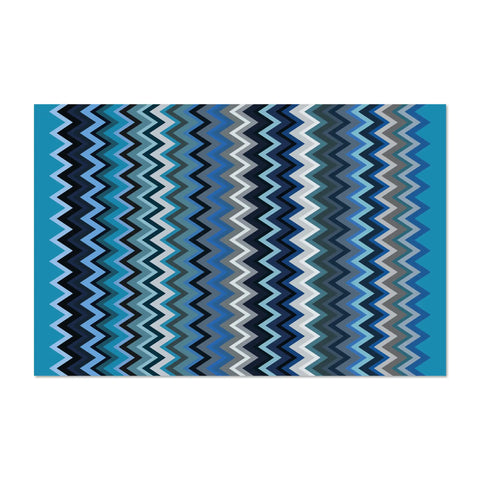 Vinyl dense rug from the ZigZag collection ,118x180 cm cm size with shade of blue fashion zigzag patterns. Perfect for the living room or the kitchen areas, they are non-Slip and durable and perfect for indoor and outdoor use to enhance your floors.